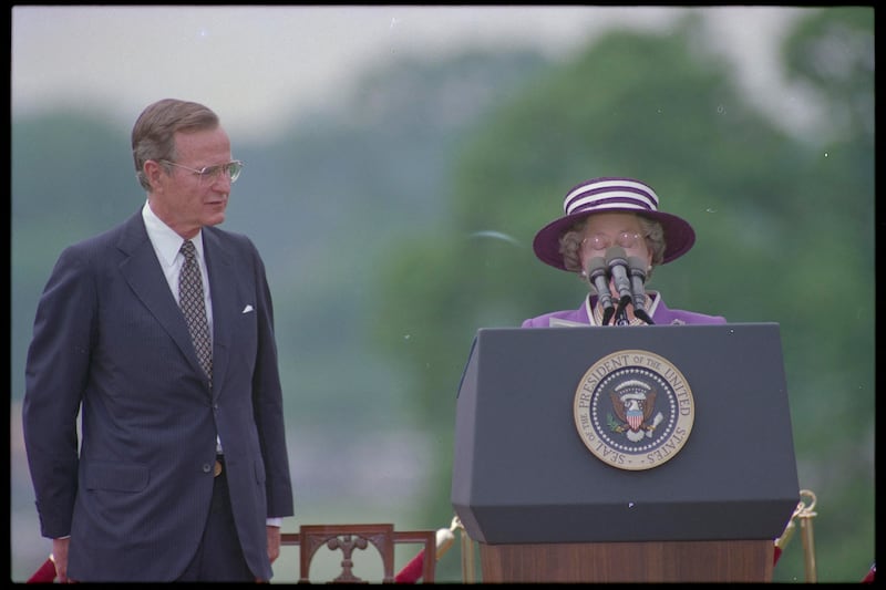 Queen Elizabeth II of England is dwarfed by the podium as she makes her opening remarks at the White House cermeony, welcoming her to the US . Someone forgot to put her stand in place.  May 14, 1991 REUTERS/Gary Hershorn 91203077  ADDRESSING DC ENGLAND HAT HEADSHOT PRESS CONF ROYALTY US; Queen Elizabeth  Queen Elizabeth II George Bush  DISCLAIMER: The image is presented in its original, uncropped, and untoned state. Due to the age and historical nature of the image, we recommend verifying all associated metadata, which was transferred from the index stored by the Bettmann Archives, and may be truncated.