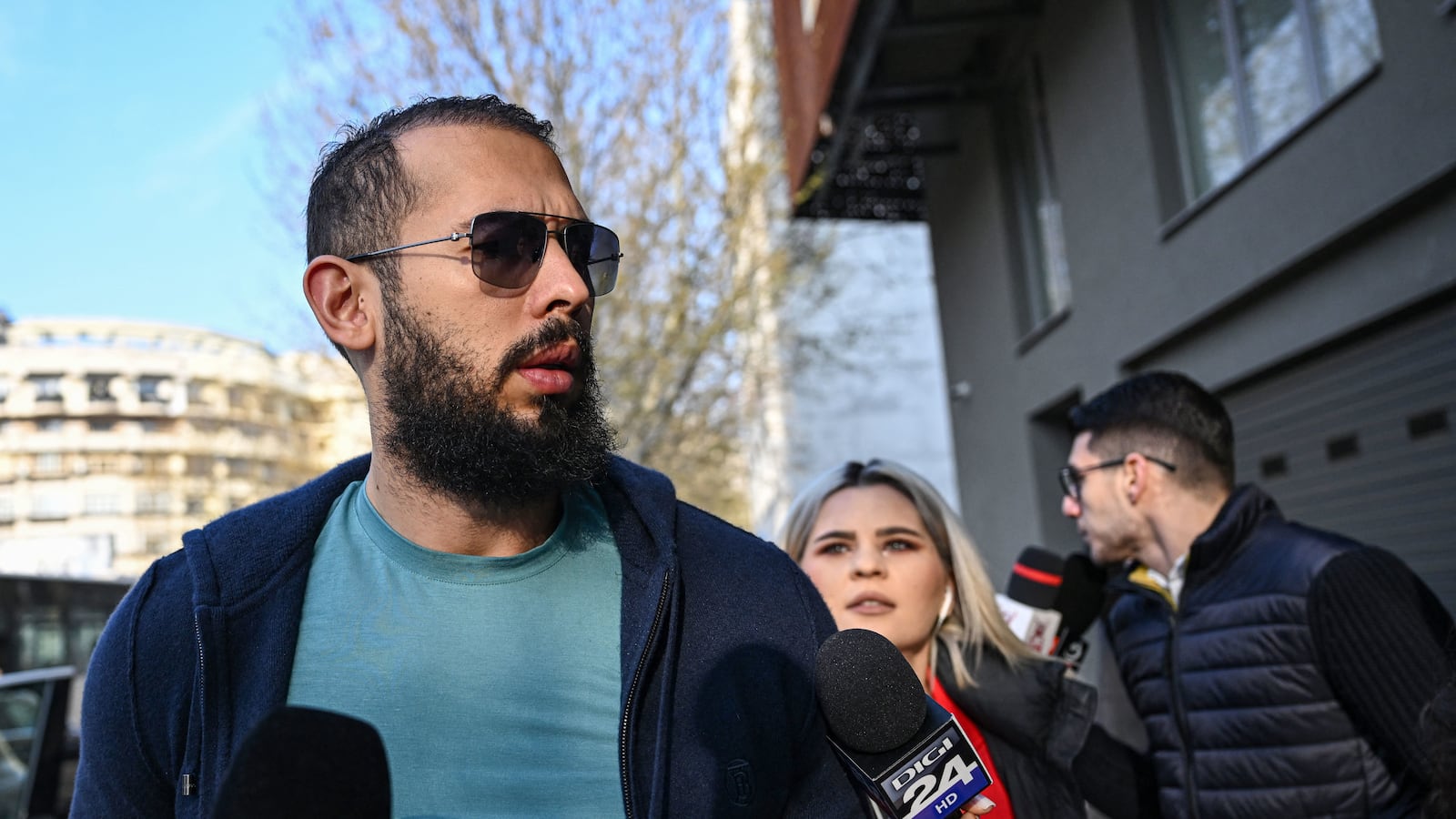 Andrew Tate at the Directorate for a hearing.