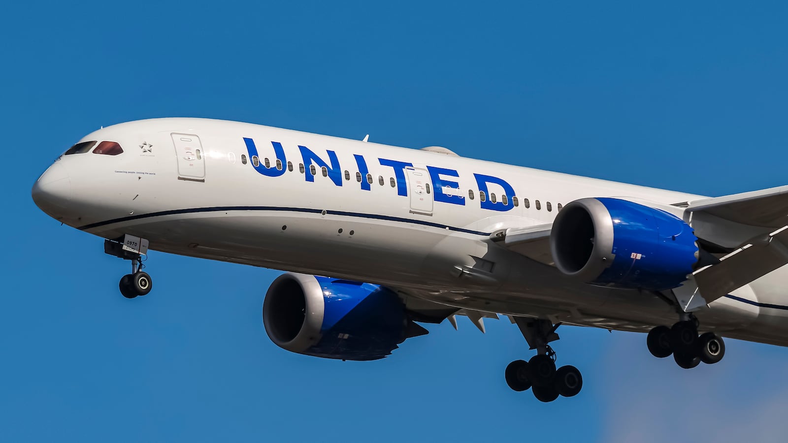 United Airlines Boeing 787-9 Dreamliner aircraft spotted flying on final approach for landing at London Heathrow Airport in the United Kingdom. The Boeing 787 Dreamliner wide body passenger airplane has the registration tail number N26970 and is powered by 2x GE Genx-1b74/75 jet engines. United is a major US airline carrier with headquarters and main hub base at Chicago, USA with a fleet of 967 planes ranking on of the largest airlines in the world, member of Star Alliance aviation group. The airliner arrives from Los Angeles LAX as flight UA923. London, England, UK on September 2024 (Photo by Nicolas Economou/NurPhoto via Getty Images)