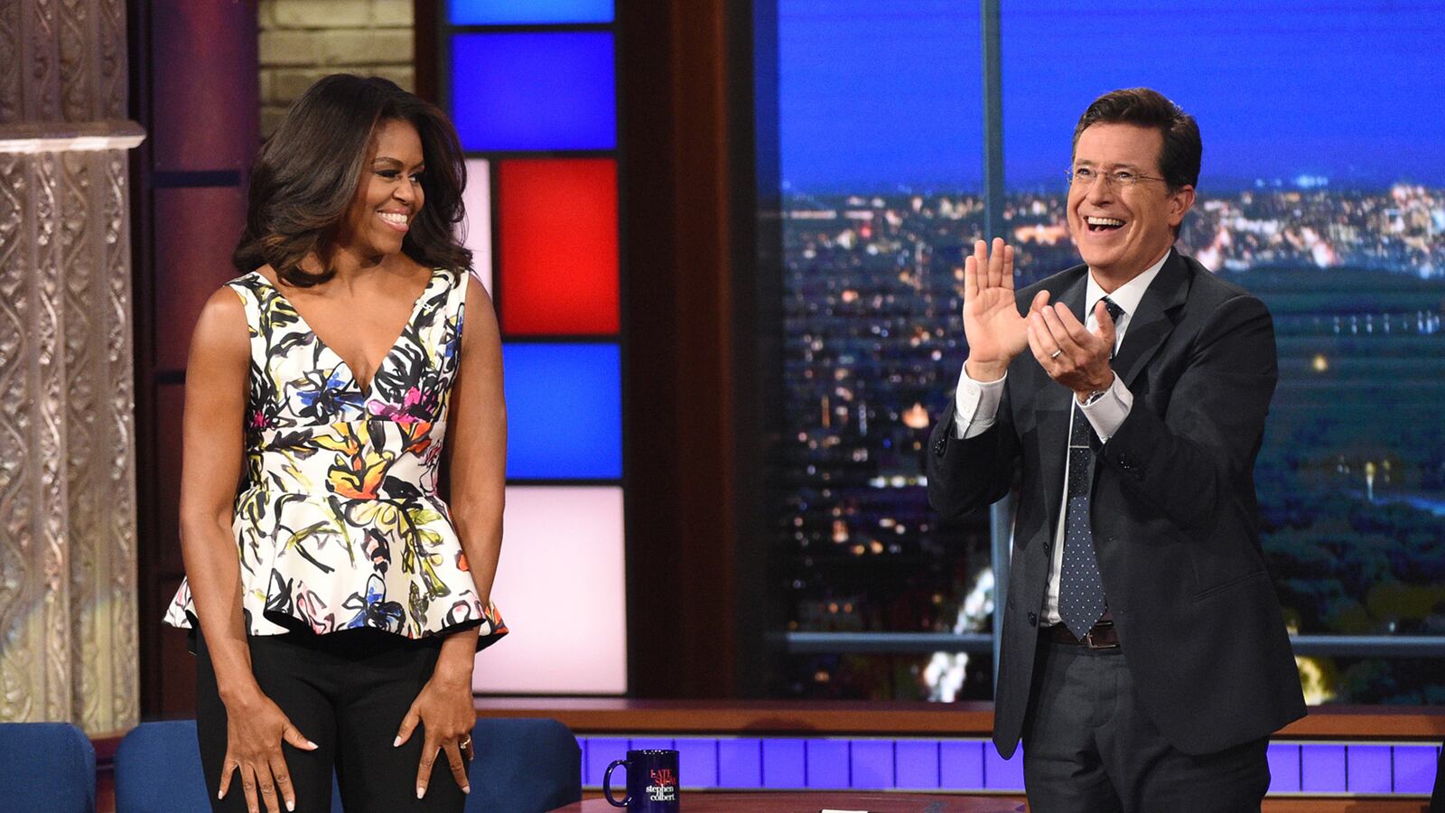 articles/2015/09/29/michelle-obama-and-stephen-colbert-share-a-laugh-at-bill-clinton-s-expense/150928-teeman-michelle-obama-tease_ladweb