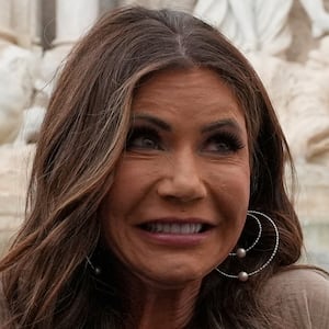 U.S. Secretary of Homeland Security Kristi Noem reacts after tossing a coin into the 18th century Trevi Fountain, in Rome, Italy, May 23, 2025. Alex Brandon/Pool via REUTERS