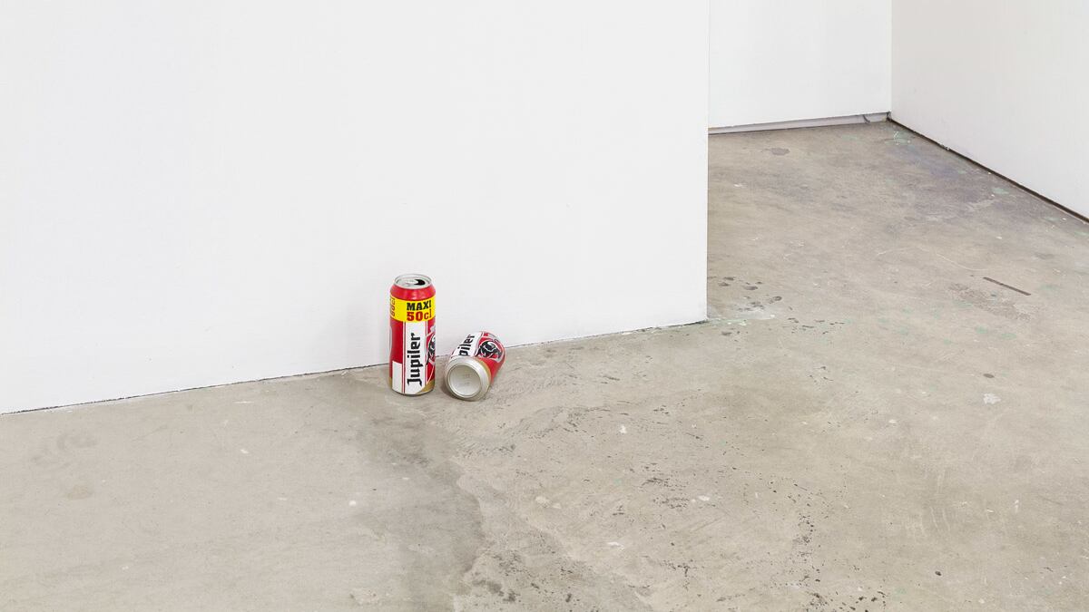 An artwork of acrylic painted cans by Alexandre Lavet is displayed.