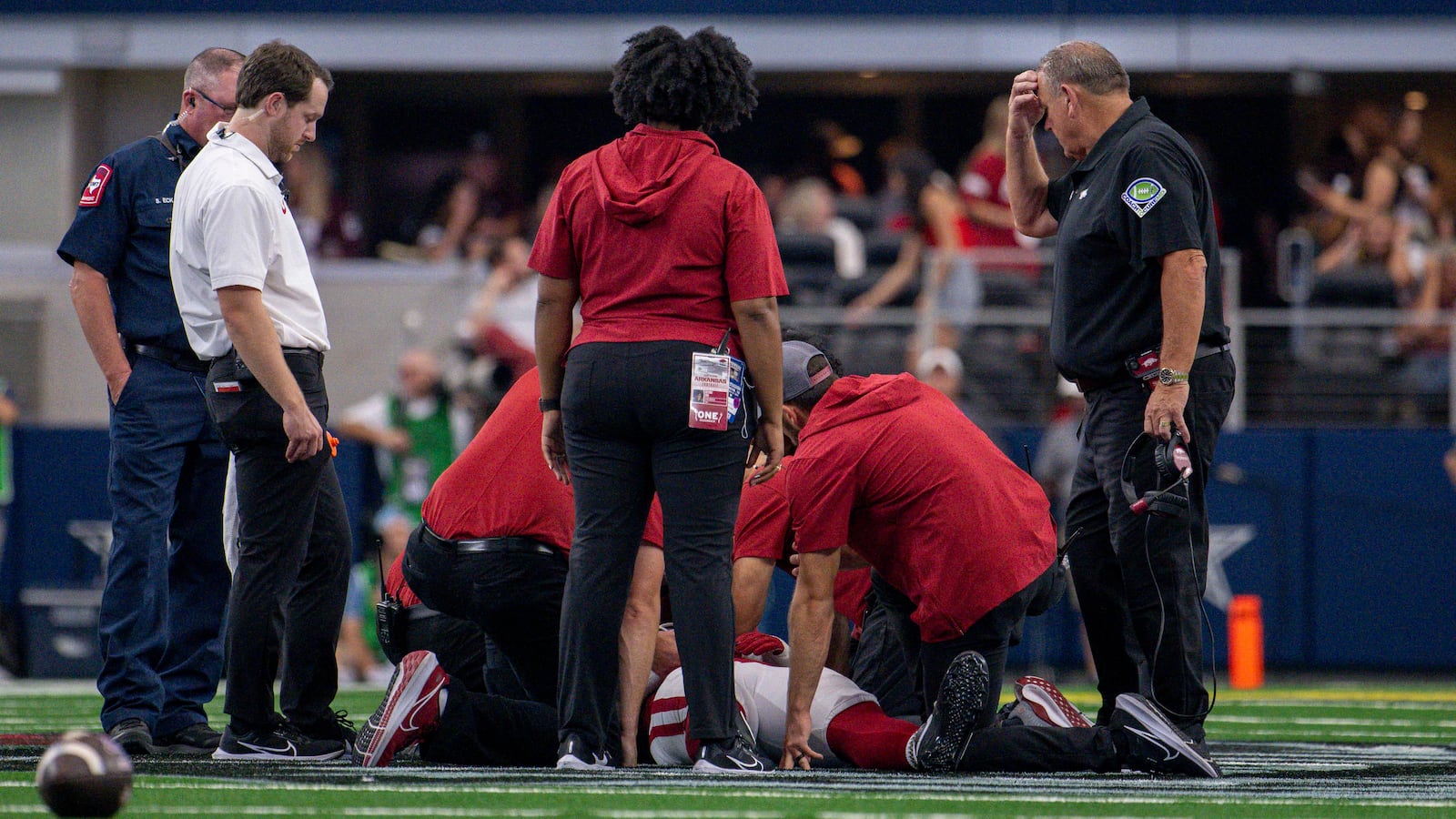 Arkansas Razorbacks head coach Sam Pittman and the medical staff check on the injury to Arkansas Razorbacks defensive lineman John Morgan.