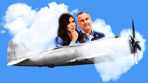 Corey Lewandowski and Kristi Noem in a propeller plane going through heart clouds