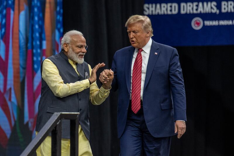 HOUSTON, TX - SEPTEMBER 22: Indian Prime Minster Narendra Modi welcomes U.S. President Donald Trump to the stage at NRG Stadium during a rally on September 22, 2019 in Houston, Texas. The rally was expected to draw tens of thousands of Indian-Americans and comes ahead of Modi's trip to New York for the United Nations General Assembly. (Photo by Sergio Flores/Getty Images)