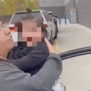 The family tries to wash pepper spray out of their eyes after their car was pepper-sprayed by federal agents on November 8, 2025.