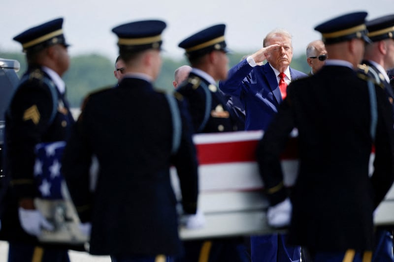 Trump salutes as members of the military carry the transfer case of U.S. Army Sgt. Angel S. Rampersad of the 1st Battalion, 57th Air Defense Artillery Regiment, 52nd Air Defense Artillery Brigade, 10th Army Air Missile Defense Command, who was killed during an attack at Muwaffaq Salti Air Base in Jordan.