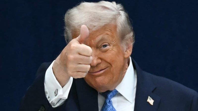 U.S. President Donald Trump gives a thumbs up.