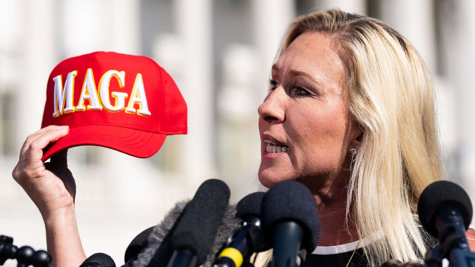 WASHINGTON - MAY 1: Rep. Marjorie Taylor Greene, R-Ga., holds her "Make America Great Again" hat during the news conference outside the U.S. Capitol on Wednesday, May 1, 2024, announcing she will move forward next week on the motion to vacate Speaker Mike Johnson. (Bill Clark/CQ-Roll Call, Inc via Getty Images)