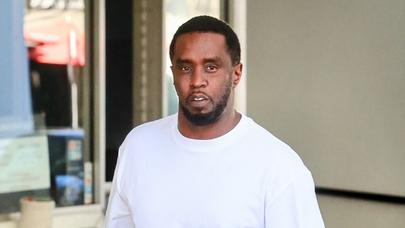 Sean "Diddy" Combs walks outside in a T-shirt in Beverly Hills in 2023.