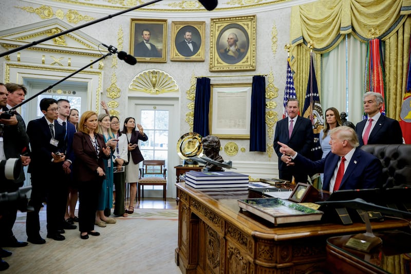 Trump takes questions from reporters in the Oval Office shortly after announcing his media ban.