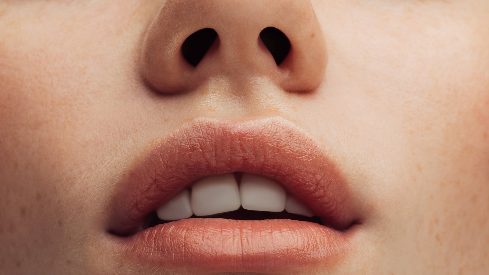 a woman's lips with lip balm