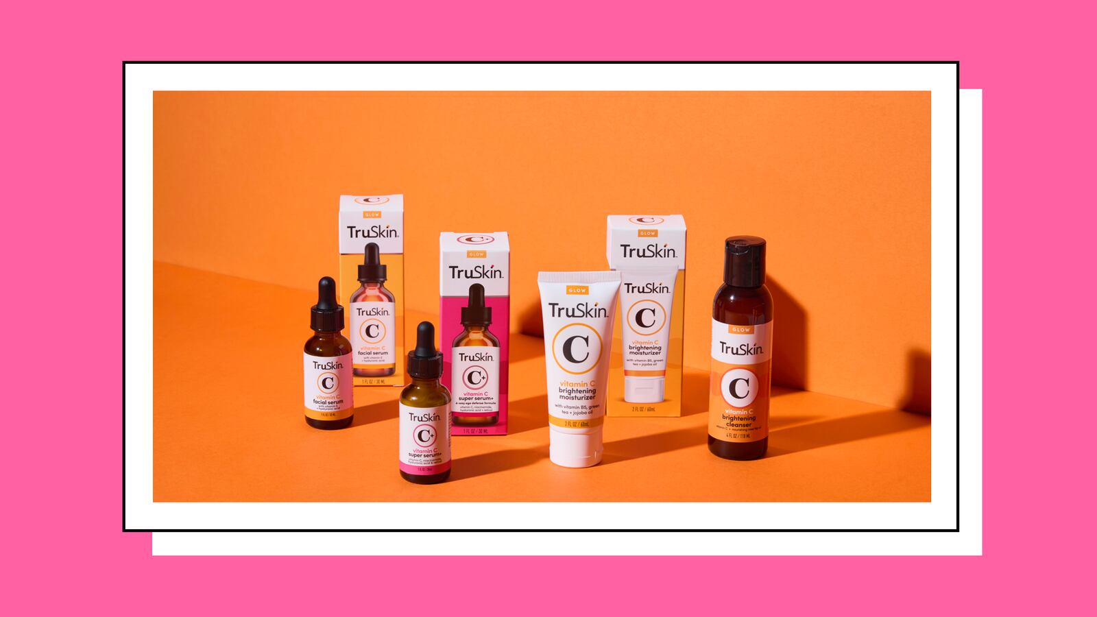 TruSkin's collection of skincare products on an orange background.