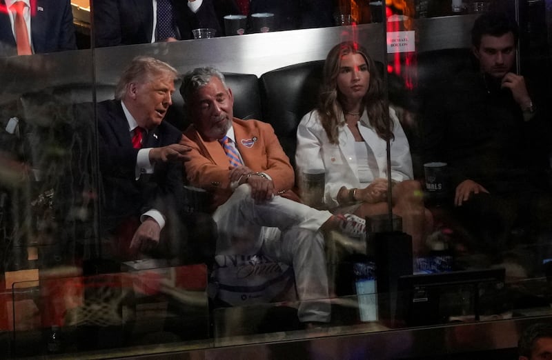 President Donald Trump, his granddaughter Kai Trump, and New York Knicks owner James Dolan, attend Game 3 of the NBA Finals at Madison Square Garden.