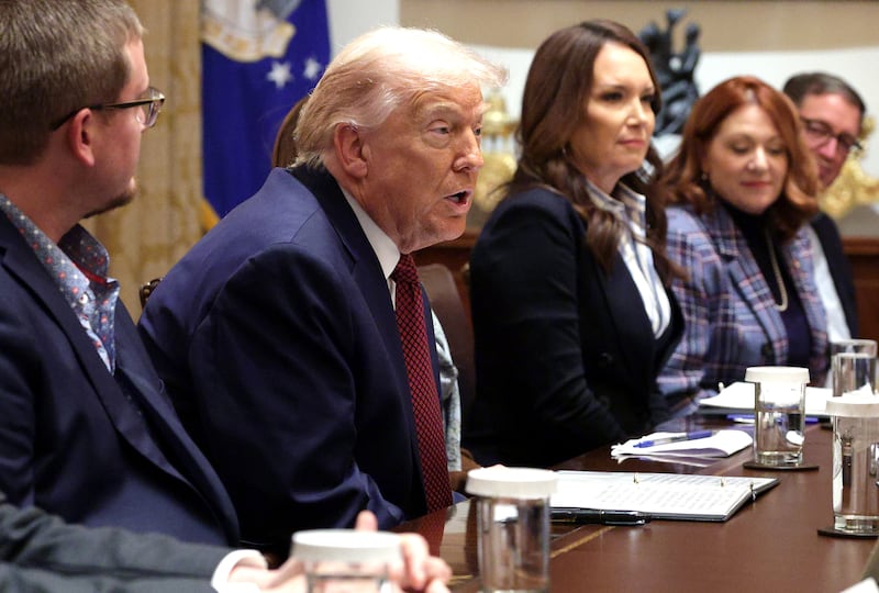 WASHINGTON, DC - DECEMBER 08: U.S. President Donald Trump, joined by Agriculture Secretary Brooke Rollins, participates in a roundtable discussion with farmers in the Cabinet Room of the White House on December 08, 2025 in Washington, DC. President Trump is expected to announce a $12 billion farm aid package, which includes one-time payments to those affected by the administration’s trade policies. (Photo by Alex Wong/Getty Images)