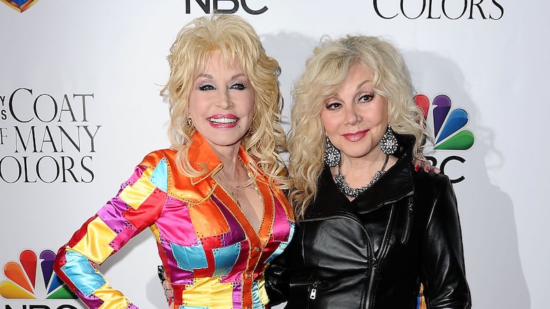 HOLLYWOOD, CA - DECEMBER 02:  Dolly Parton and Stella Parton attend the premiere of "Dolly Parton's Coat Of Many Colors" at the Egyptian Theatre on December 2, 2015 in Hollywood, California.  (Photo by Jason LaVeris/FilmMagic)