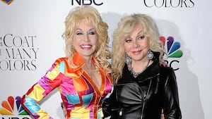 HOLLYWOOD, CA - DECEMBER 02: Dolly Parton and Stella Parton attend the premiere of "Dolly Parton's Coat Of Many Colors" at the Egyptian Theatre on December 2, 2015 in Hollywood, California. (Photo by Jason LaVeris/FilmMagic)