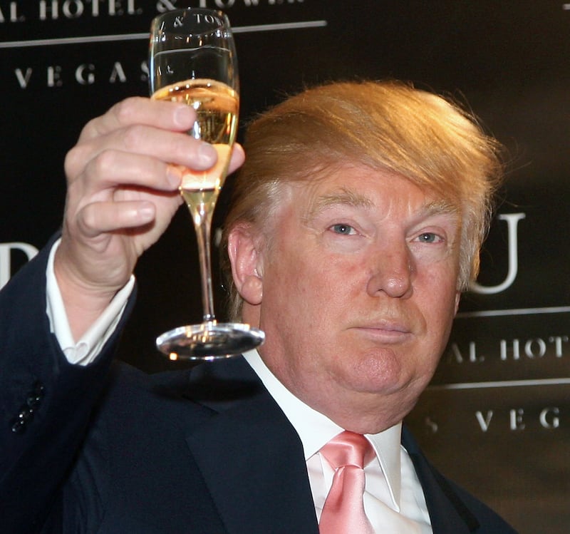 Donald Trump leads a champagne toast during an opening ceremony for the Trump International Hotel & Tower in Las Vegas in 2008.