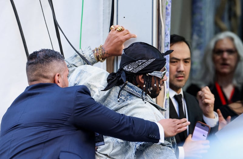 Chris Smalls is detained after trying to enter the venue with a protest sign during the Met Gala, an annual fundraising gala held for the benefit of the Metropolitan Museum of Art's Costume Institute with this year's theme 'Costume Art' in New York City, New York, U.S., May 4, 2026.