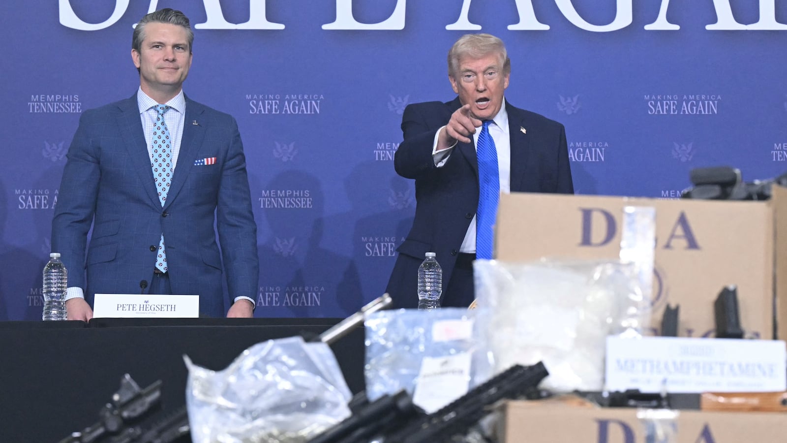 US President Donald Trump, flanked by Defense Secretary Pete Hegseth and Attorney General Pam Bondi, participates in his Memphis Safe Task Force anti-crime initiative roundtable in Memphis, Tennessee, on March 23, 2026. (Photo by SAUL LOEB / AFP via Getty Images)