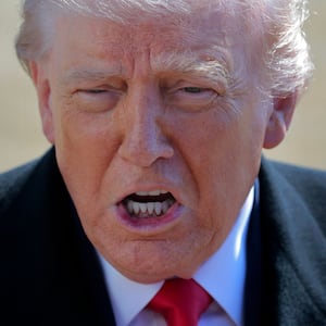 U.S. President Donald Trump talks with reporters before he and first lady Melania Trump leave the White House on February 13, 2026 in Washington, DC.