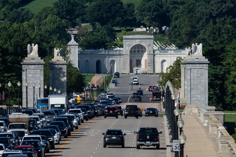 Vehicles drive past along the Memorial Bridge near Memorial Circle in Arlington, Virginia, the proposed site for U.S. President Donald Trump's "Triumphal Arch", seen from the Lincoln Memorial in Washington, D.C., U.S., September 8, 2026.