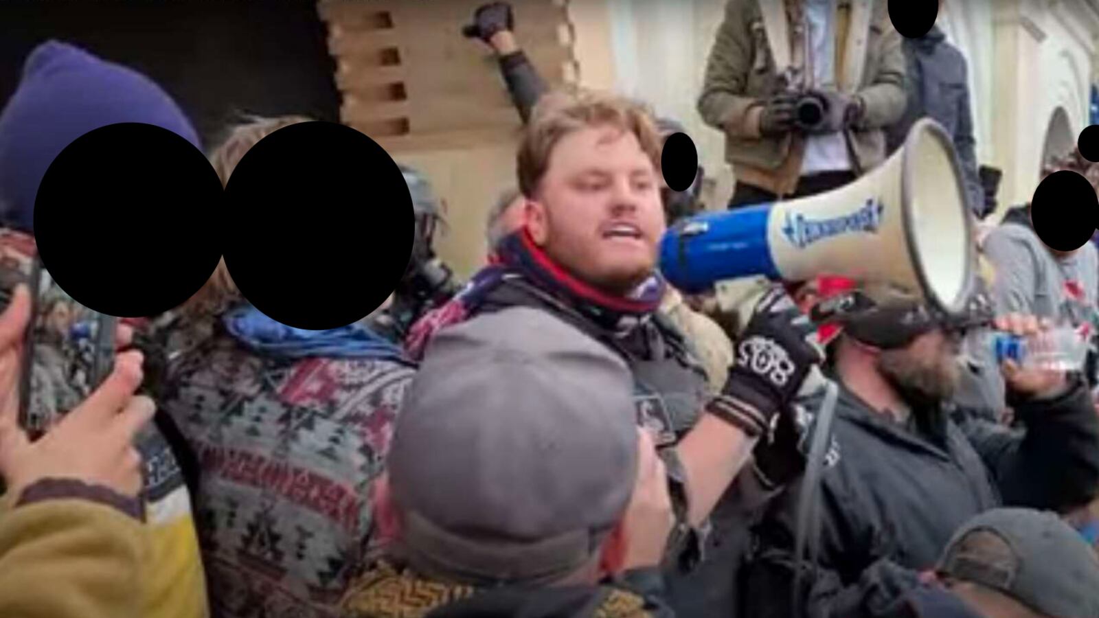 Anthony Alexander Antonio holds a megaphone as he rallies rioters at the U.S. Capitol.