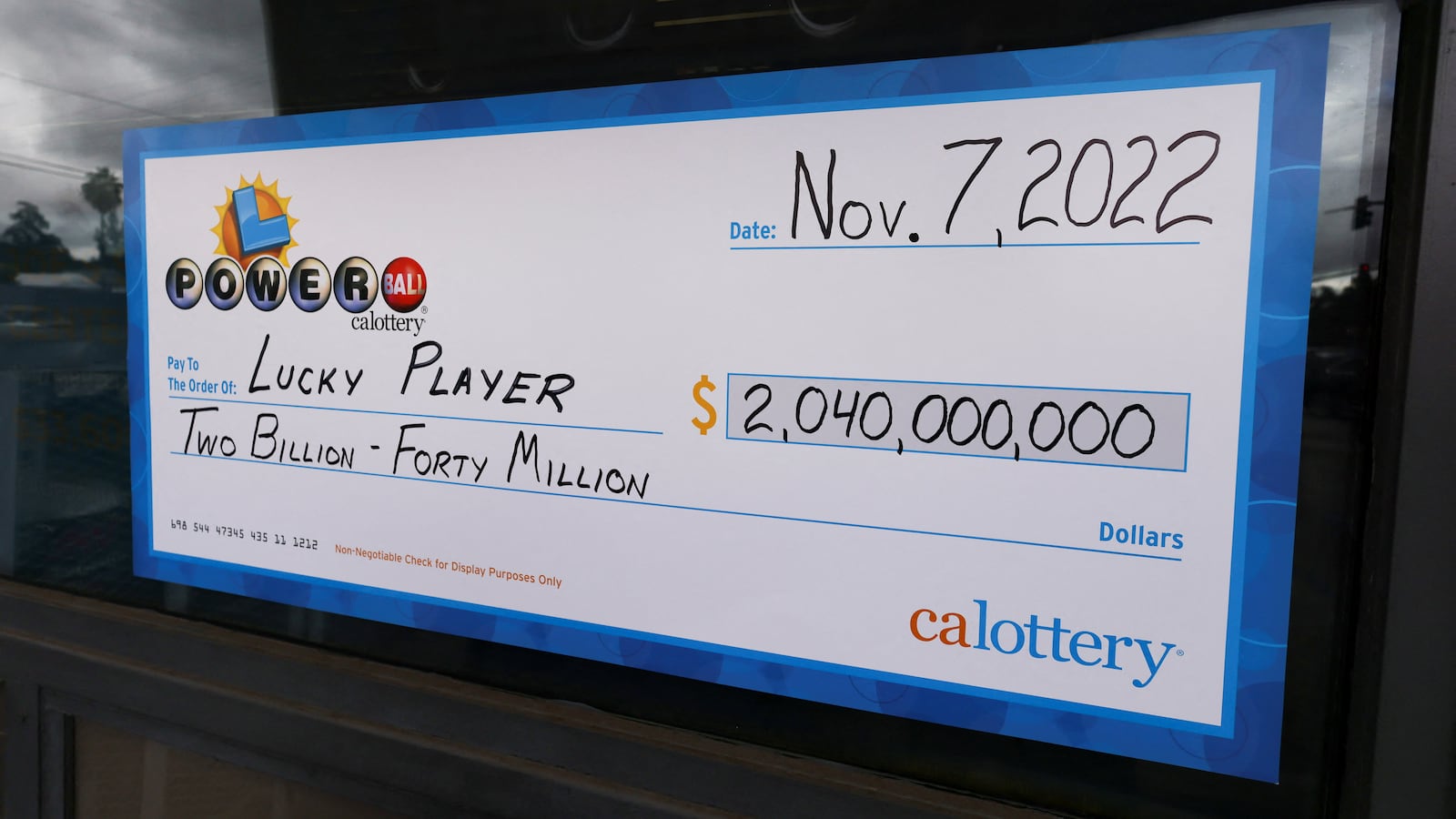 Check displayed at store where winning Powerball ticket was sold.