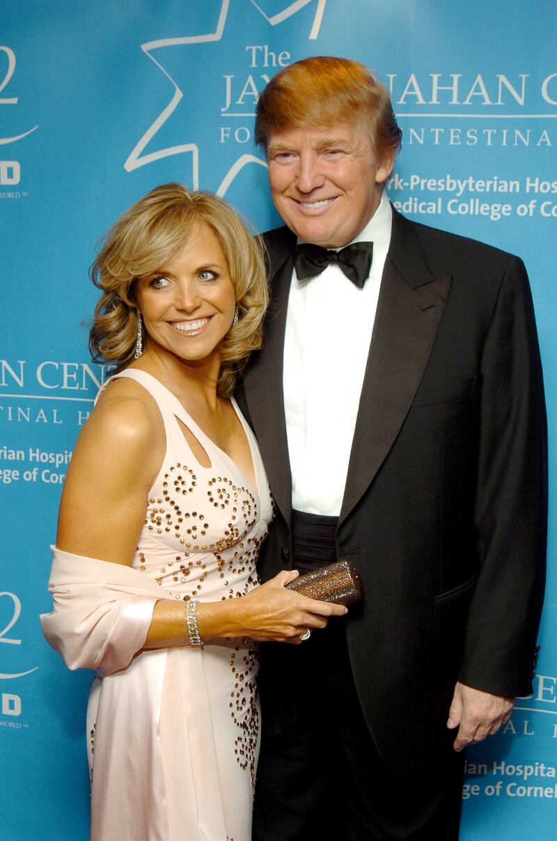 Katie Couric and Donald Trump attend a charity gala benefit on the Queen Mary 2 ocean liner in New York City on April 24, 2004.