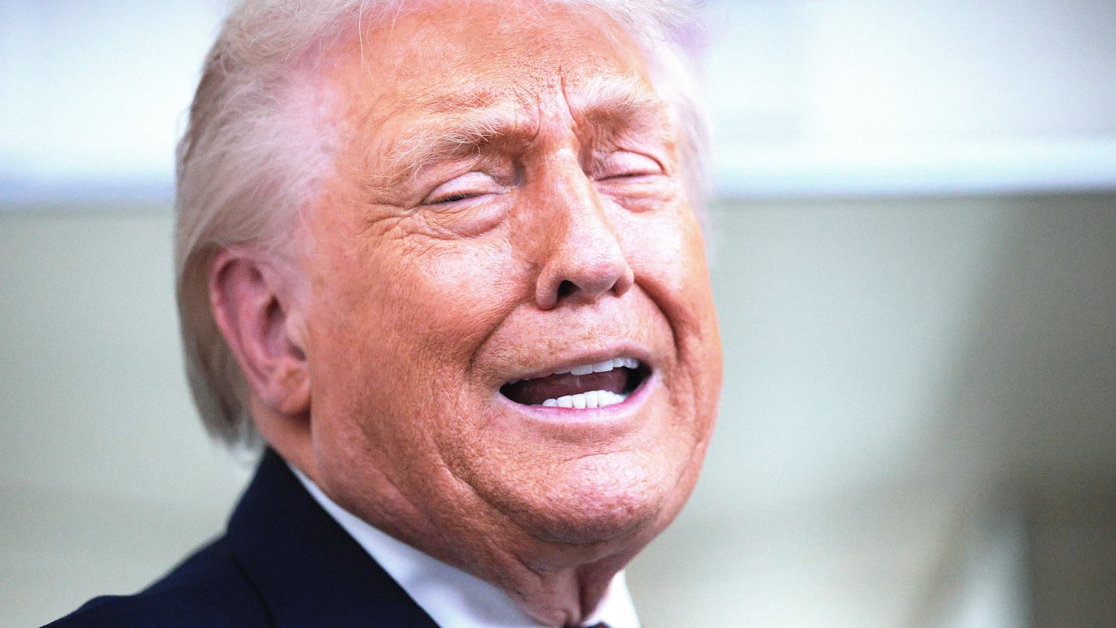 U.S. President Donald Trump speaks to reporters on board Air Force One
