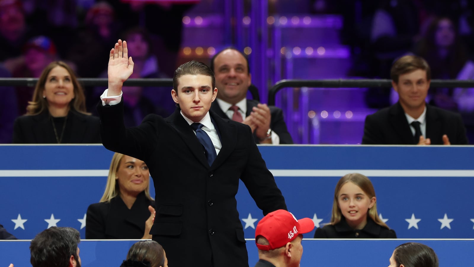 Barron Trump waves to the crowd during an indoor inauguration parade at Capital One Arena on January 20, 2025 in Washington, DC. Donald Trump takes office for his second term as the 47th president of the United States.