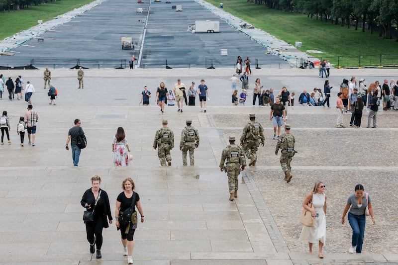 Visitors walk near the Lincoln Memorial Reflecting Pool on May 26, 2026 in Washington, DC as President Trump has initiated numerous construction projects on federal government properties including painting it "American flag blue."