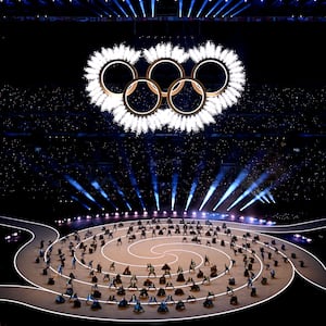 A general view as the Olympic rings come together for a fireworks display during the opening ceremony of the Milano Cortina 2026 Winter Olympics at San Siro Stadium.