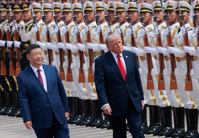 U.S. President Donald Trump inspects an honour guard during a welcome ceremony with Chinese President Xi Jinping at the Great Hall of the People in Beijing, China, May 14, 2026.