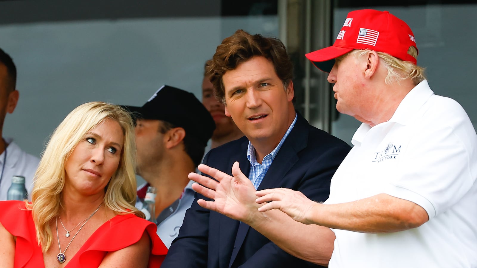 BEDMINSTER, NJ - JULY 31: Former President Donald Trump, Tucker Carlson and Marjorie Taylor Greene during the 3rd round of the LIV Golf Invitational Series Bedminster on July 31, 2022 at Trump National Golf Club in Bedminster, New Jersey. (Photo by Rich Graessle/Icon Sportswire via Getty Images)