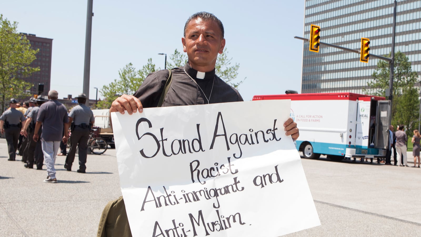 articles/2016/07/20/the-priest-who-walked-360-miles-to-protest-donald-trump-at-rnc-2016/160719-Mak-walking-protestors-tease_ln8grq