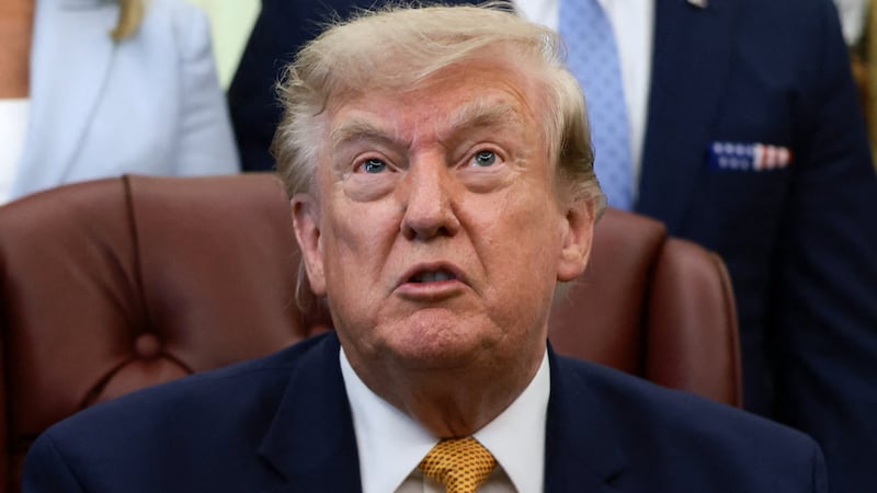 U.S. President Donald Trump answers questions from the media after signing an executive order establishing the President's Military Spouse Commission to be chaired by Jennifer Rauchet, wife of Secretary of Defense Pete Hegseth, in the Oval Office at the White House in Washington, D.C., U.S., August 3, 2026. REUTERS/Evelyn Hockstein