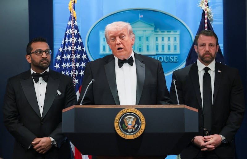 U.S. President Donald Trump speaks next to Federal Bureau of Investigation (FBI) Director Kash Patel and Homeland Security Secretary Markwayne Mullin at a press briefing at the White House, following a shooting incident during the annual White House Correspondents’ Association dinner, in Washington, D.C., U.S., April 25, 2026 REUTERS/Jonathan Ernst