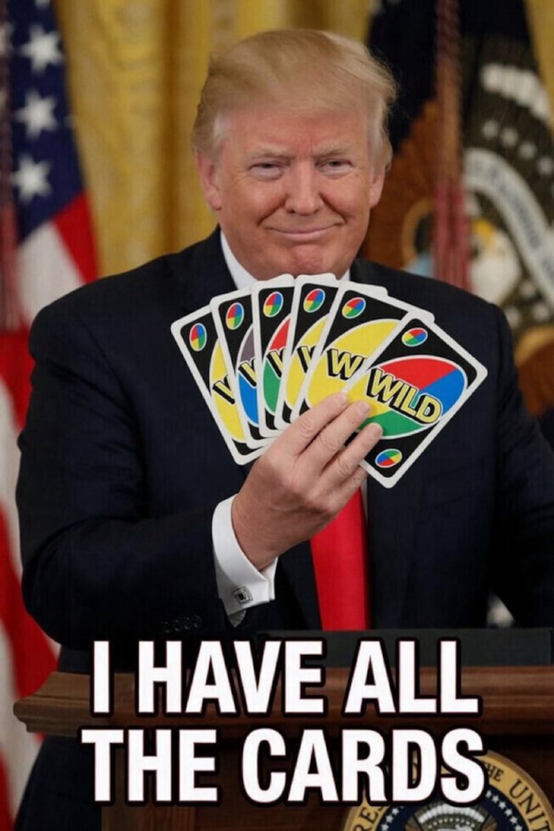 Trump holding Uno cards with the caption "I have all the cards."
