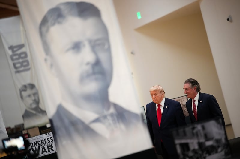 MEDORA, NORTH DAKOTA - JULY 01: U.S. President Donald Trump (C) and U.S. Interior Secretary Doug Burgum receive a tour of the Theodore Roosevelt Presidential Library on July 01, 2026 in Medora, North Dakota. The privately funded library and museum, located at the edge of Theodore Roosevelt National Park in North Dakota's Badlands, will hold its grand opening on July 4th to coincide with the nation's 250th anniversary. (Photo by Andrew Harnik/Getty Images)