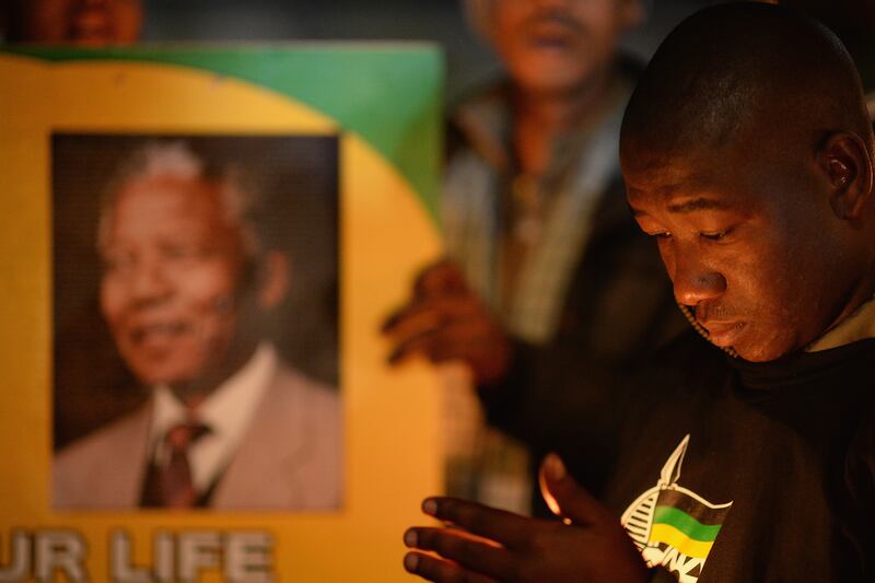 galleries/2013/06/29/week-in-photos-june-29-2013/130627-mandela-prayer-wip_oqe3b4