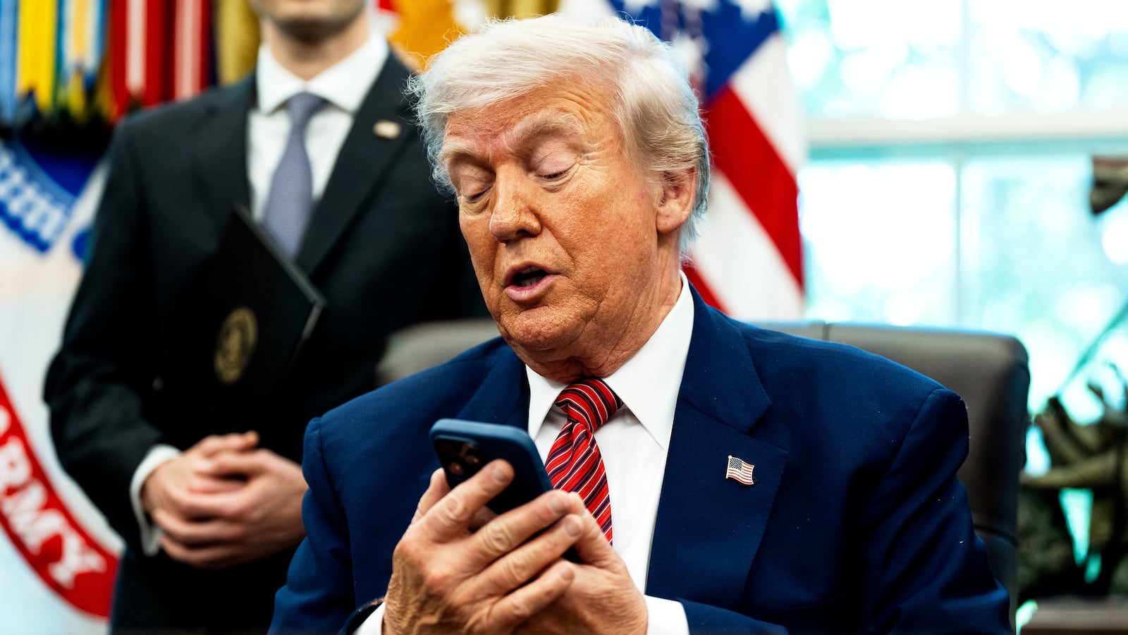 WASHINGTON, DC May 23, 2025:
US President Donald Trump silenced his cellphone in the Oval Office of the White House on Friday May 23, 2025. The executive orders were related to the nuclear power industry in the US.
(Photo by Demetrius Freeman/The Washington Post via Getty Images)