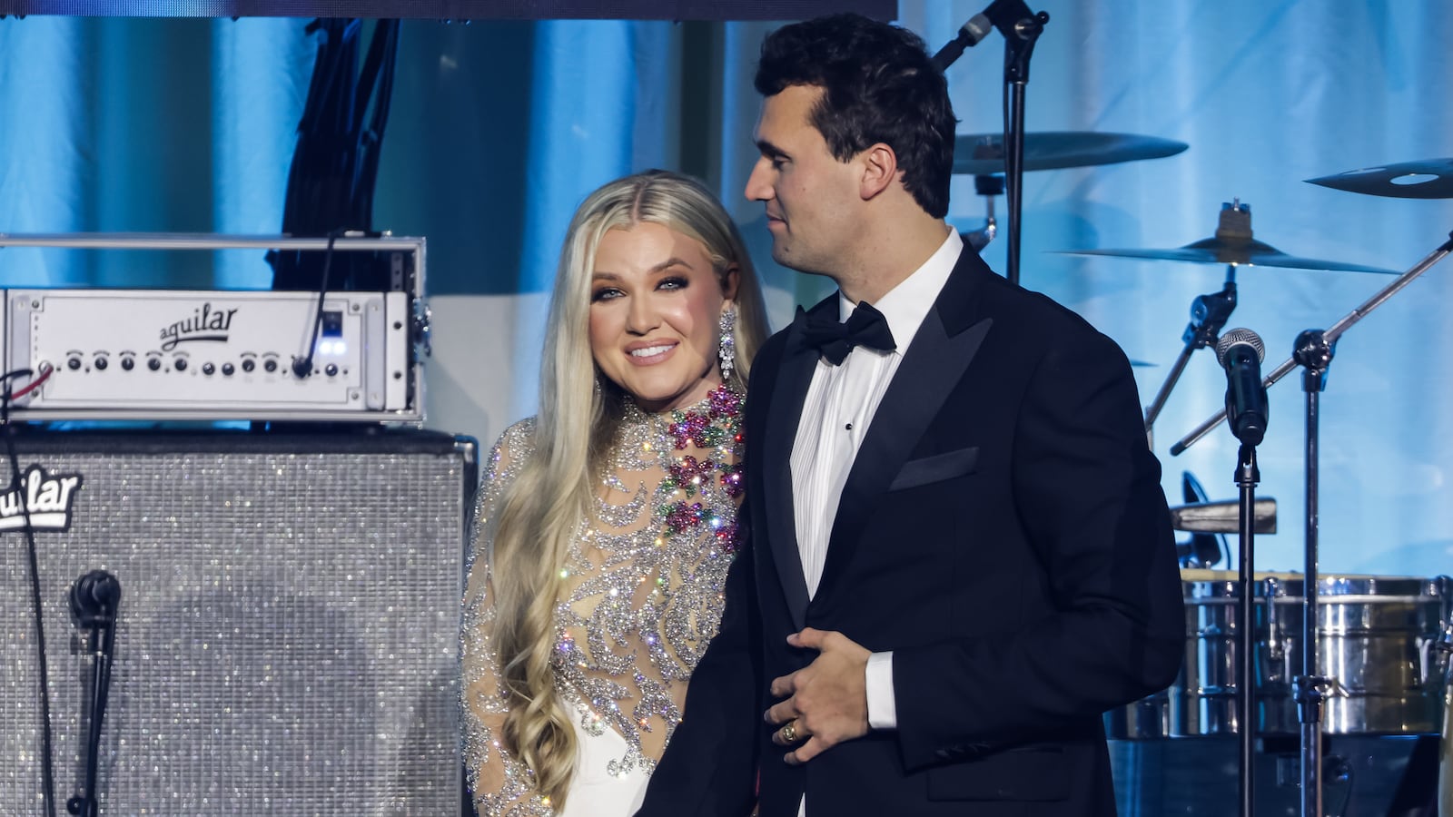 Charlie Kirk (R) and and his wife Erika Lane Frantzve (L) on stage during the Turning Point USA Inaugural-Eve Ball