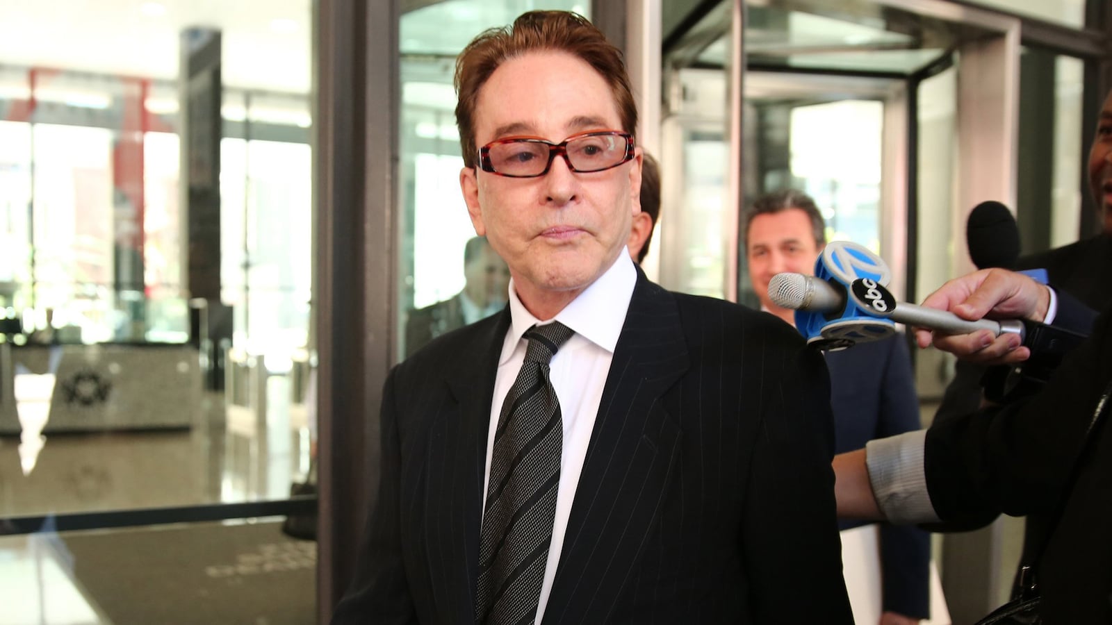 Beanie Babies founder Ty Warner is escorted from the Dirksen U.S. Courthouse in Chicago, Illinois, on Wednesday, Oct. 2, 2013.