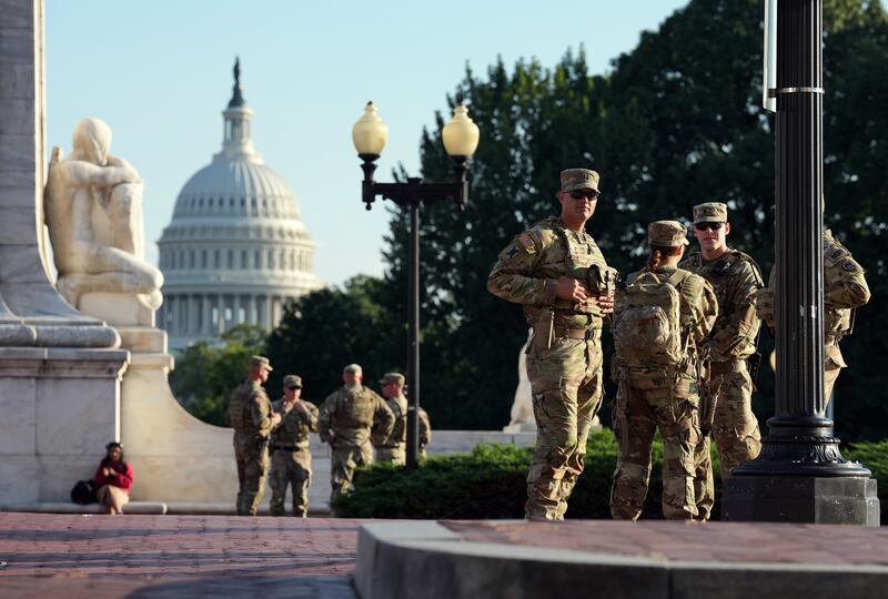 WASHINGTON, DC - AUGUST 25: Members of the National Guard armed with sidearms patrol Union Station on August 25, 2025 in Washington, DC. The Trump administration has deployed federal officers and the National Guard to the District in order to place the DC Metropolitan Police Department under federal control and assist in crime prevention in the nation's capital. (Photo by Kevin Dietsch/Getty Images)