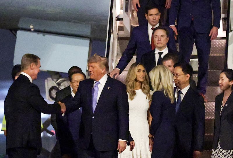 U.S. Secretary of State Marco Rubio, Tesla and SpaceX CEO Elon Musk, Eric Trump and Lara Trump depart Air Force One as U.S. President Donald Trump greets U.S. Ambassador to China David Perdue upon arrival at Beijing Capital International Airport on May 13, 2026 in Beijing, China.