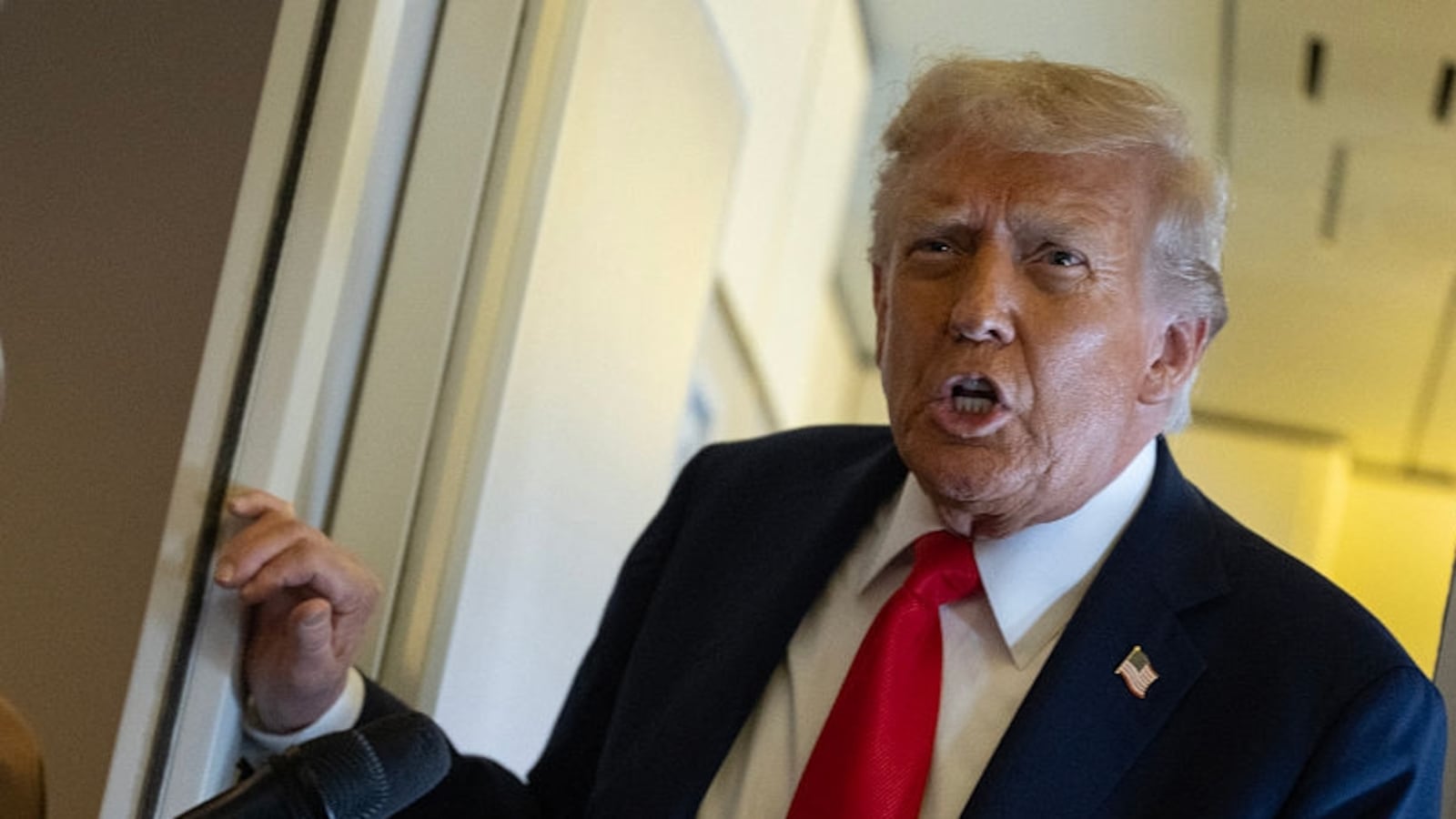 US President Donald Trump speaks to the press as he flies back to the United States from the United Kingdom onboard Air Force One on September 18, 2025. (Photo by ANDREW CABALLERO-REYNOLDS / AFP) (Photo by ANDREW CABALLERO-REYNOLDS/AFP via Getty Images)