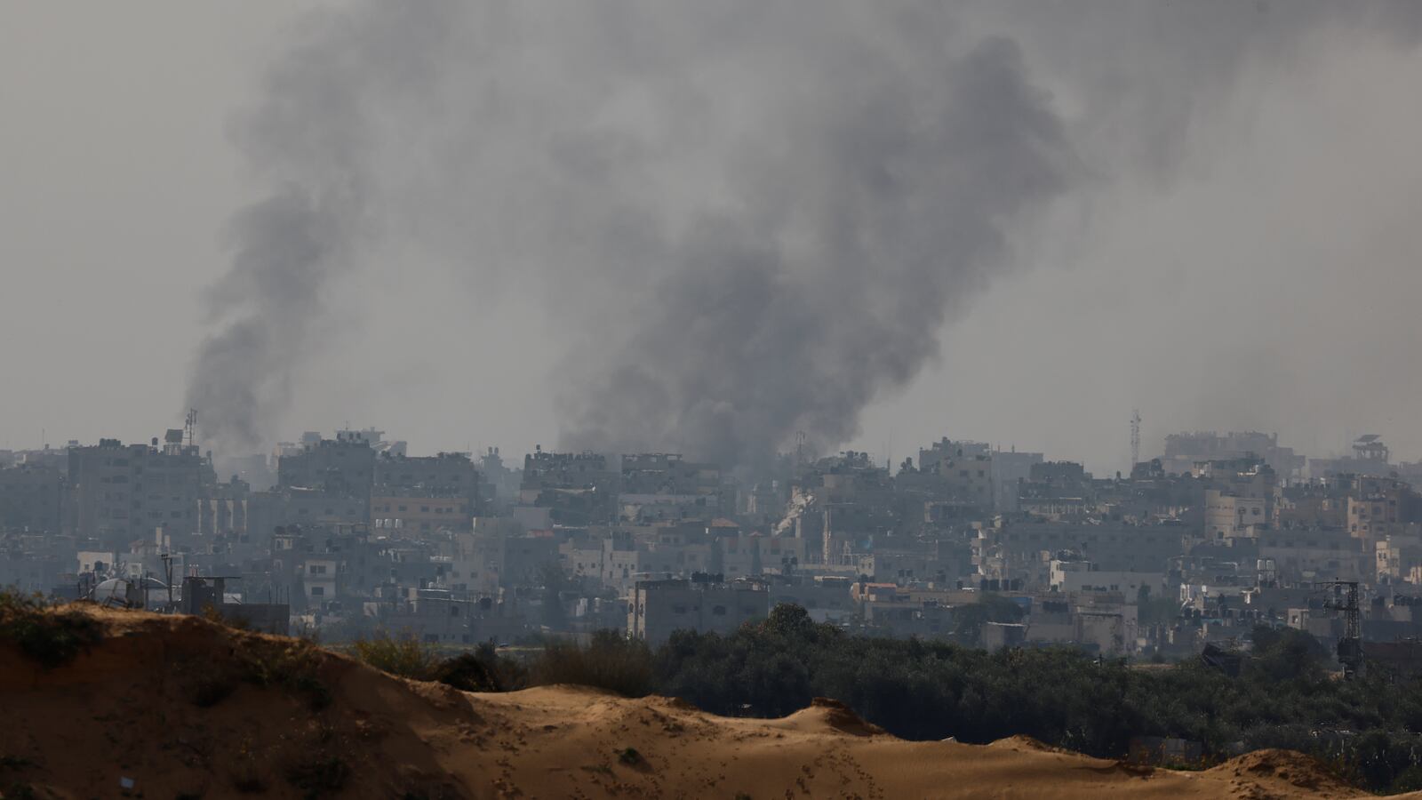 Smoke rises over Gaza, amid the ongoing conflict between Israel and the Palestinian Islamist group Hamas, as seen from southern Israel, December 8, 2023.
