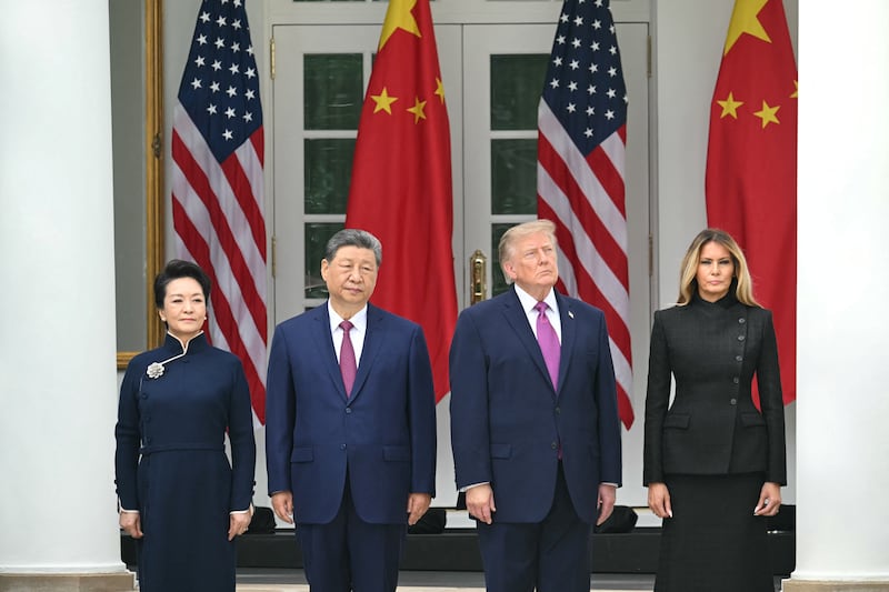 China's First Lady Peng Liyuan, China's President Xi Jinping, President Donald Trump and First Lady Melania Trump look on during a military review in the Rose Garden of the White House in Washington, DC, on September 24, 2026.