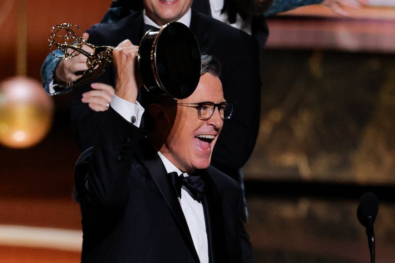 Stephen Colbert celebrates as he accepts the award for Outstanding Variety Talk Series award for "The Late Show with Stephen Colbert" at the 77th Primetime Emmy Awards in Los Angeles, California, U.S., September 14, 2025. REUTERS/Mike Blake